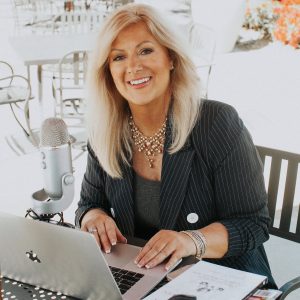 Linda P Jones at Computer and Microphone